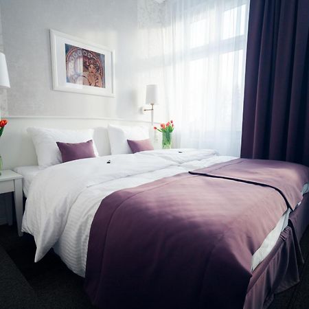 Pod Ratuszem Hotel Wieluń Szoba fotó